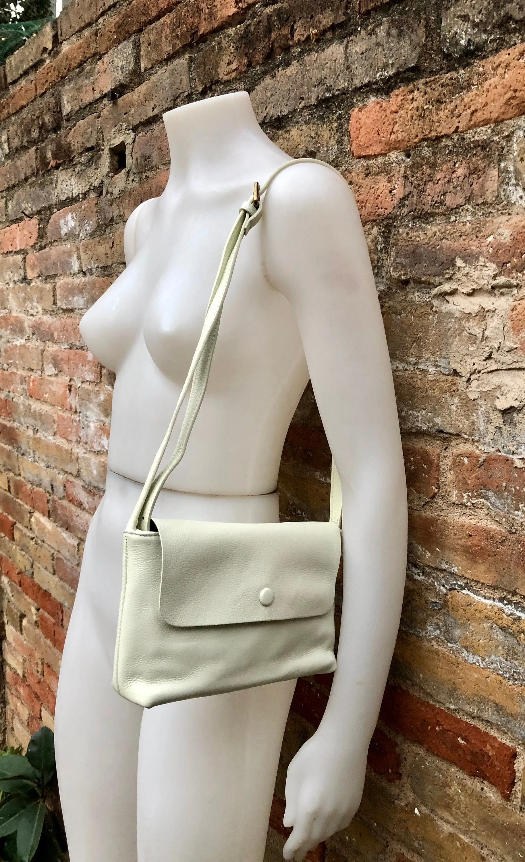 Small leather bag in cream beige. Cross body or shoulder bag in GENUINE leather. Beige leather bag with adjustable strap,  zipper and flap.