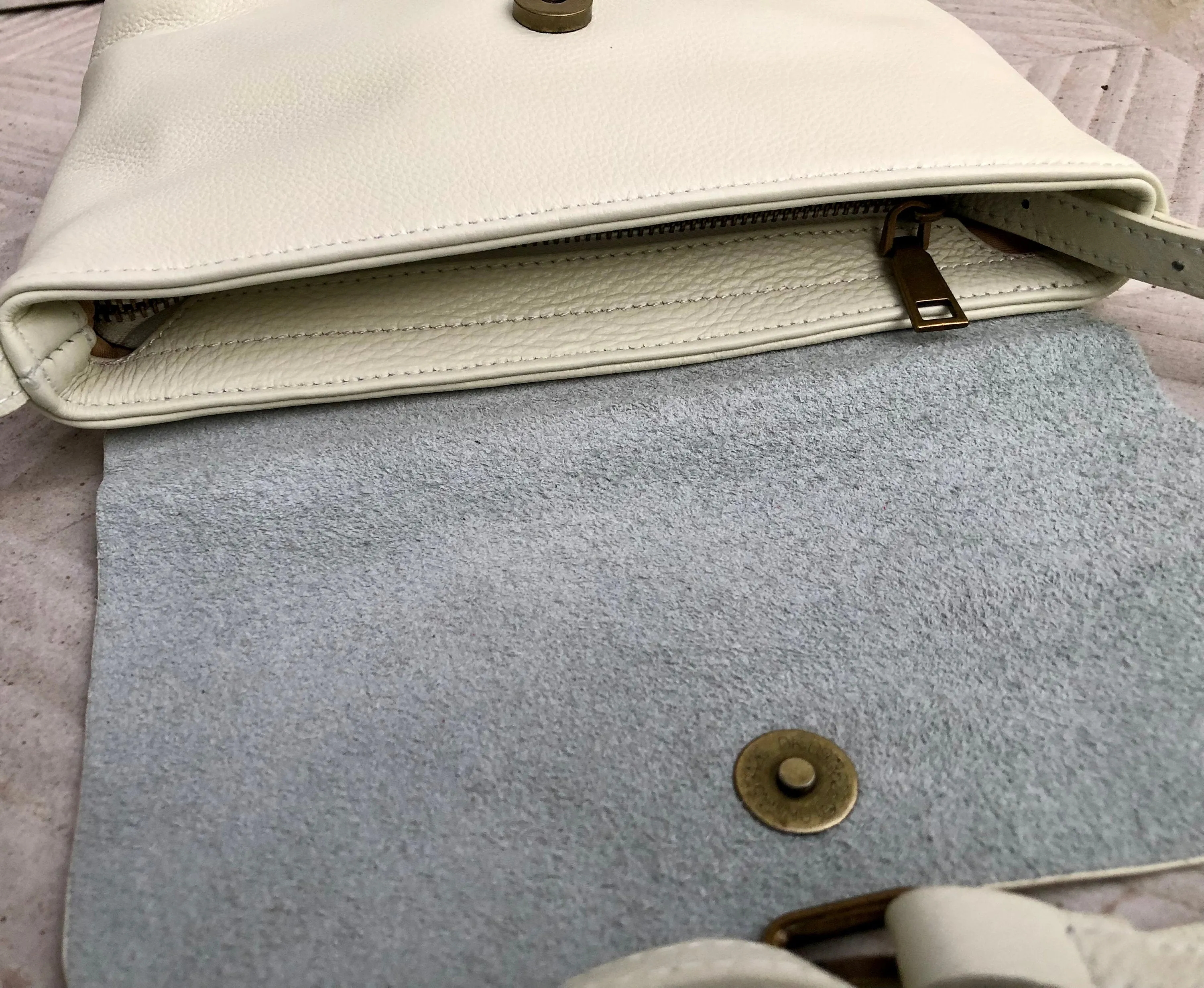 Small leather bag in cream beige. Cross body or shoulder bag in GENUINE leather. Beige leather bag with adjustable strap,  zipper and flap.