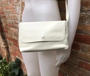 Small leather bag in cream beige. Cross body or shoulder bag in GENUINE leather. Beige leather bag with adjustable strap,  zipper and flap.