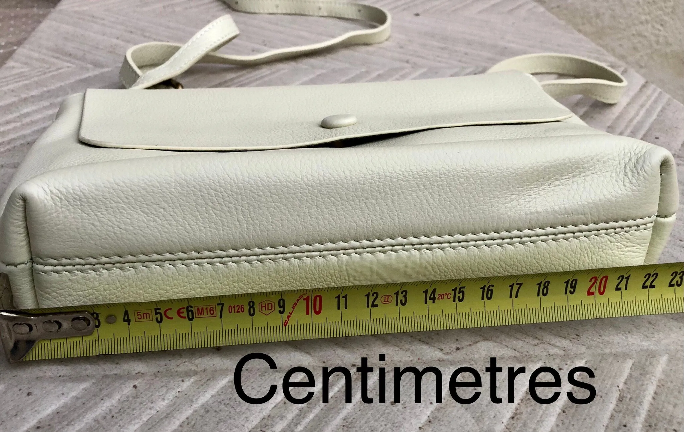Small leather bag in cream beige. Cross body or shoulder bag in GENUINE leather. Beige leather bag with adjustable strap,  zipper and flap.