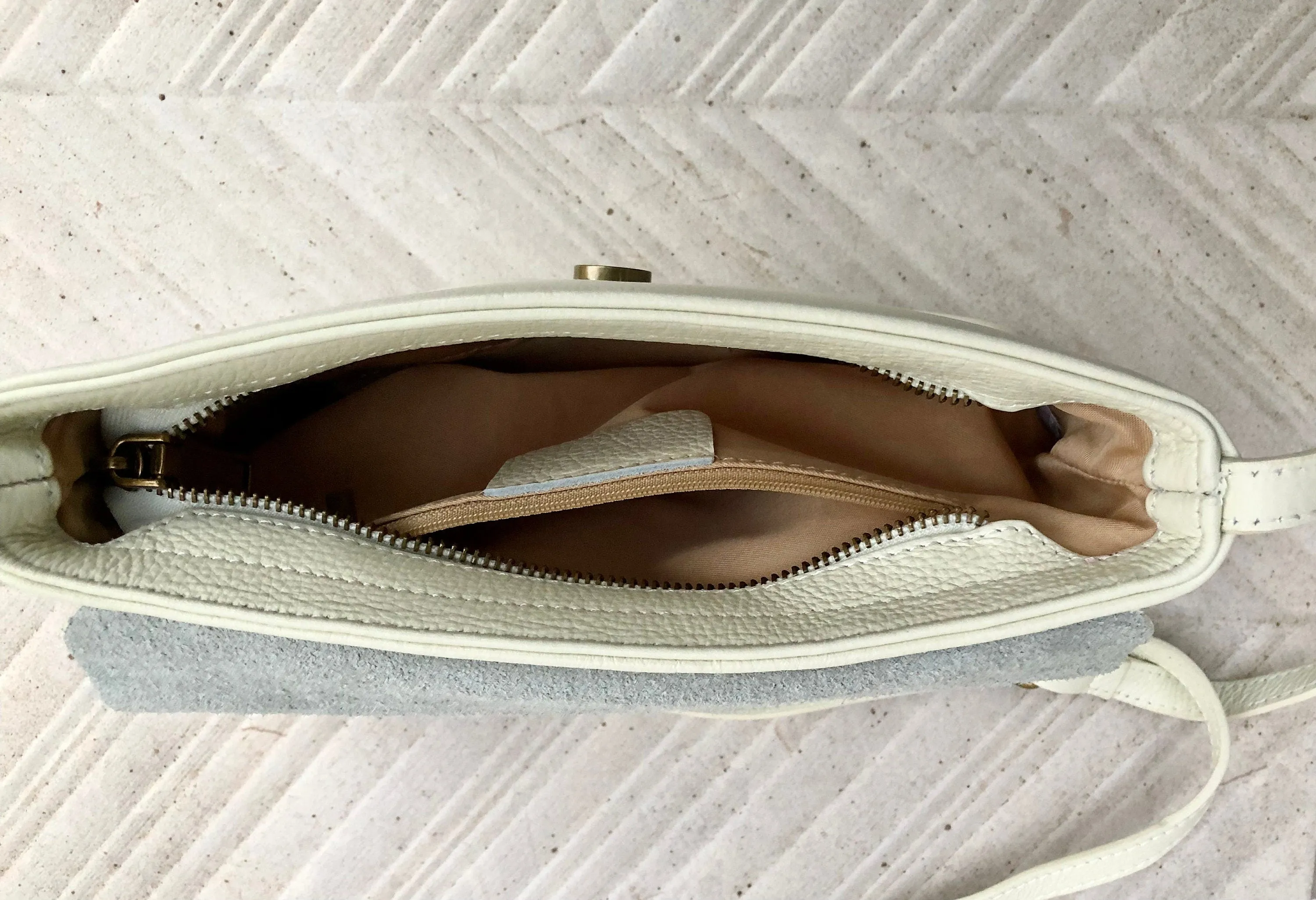 Small leather bag in cream beige. Cross body or shoulder bag in GENUINE leather. Beige leather bag with adjustable strap,  zipper and flap.